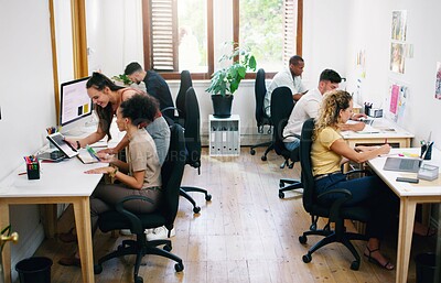 Buy stock photo Shot of a group of young businesspeople working together modern office