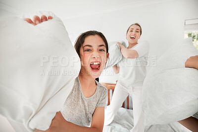 Buy stock photo Happy girl, pillow fight and portrait of mother on bed in morning together for fun bonding in home. Smile, child and excited kid playing games for laughing with cushions, mom or parent in bedroom