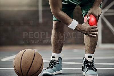 Buy stock photo Sports, injury in basketball and knee pain or athlete man while on an outdoors court holding his hurt leg during training or exercise for hobby. Closeup of male hands on glowing red body part