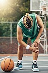 Basketball injury, sports muscle and man with medical emergency during sport game on court. Professional athlete with pain after knee accident during training for competition, event or fitness match