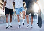 Fitness, skateboard and legs of friends at a skatepark in a city for training, sports and summer fun. Shoes, men and skateboarder group walking before a workout, practice and skating together 