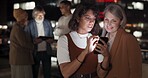 Business woman, phone and talking on night at balcony for appl planning, web search or online networking. Teamwork, late deadline discussion and digital tech smartphone collaboration on city rooftop