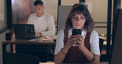 Buy stock photo Smartphone, typing and business woman in office at night, reading email and research on deadline. Phone, creative and serious professional designer on internet, website and communication in startup