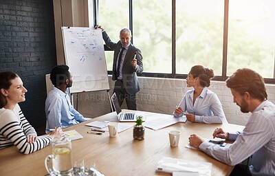 Buy stock photo Office, ceo and presentation with whiteboard for business people, employees and corporate staff. Boardroom, mature man and communications team with information, knowledge and listening in training

