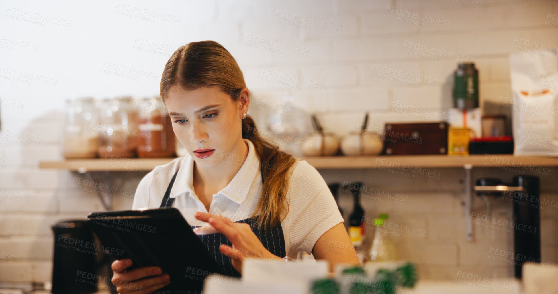 Buy stock photo Tablet, woman and barista in coffee shop for online menu for order on app for hospitality service. Inventory, reading and female waitress with digital technology for stock list in cafe or restaurant.