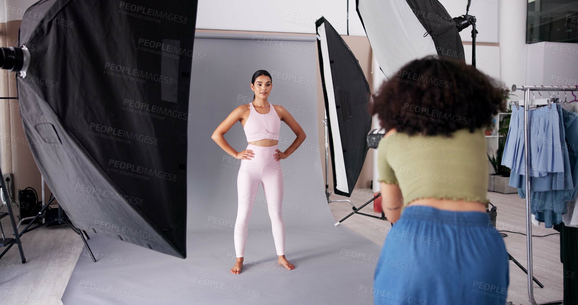 Buy stock photo Photography, fashion and model with women in studio for branding campaign, sportswear line or promotion. Behind the scenes, ecommerce photoshoot or media launch with people on set for project