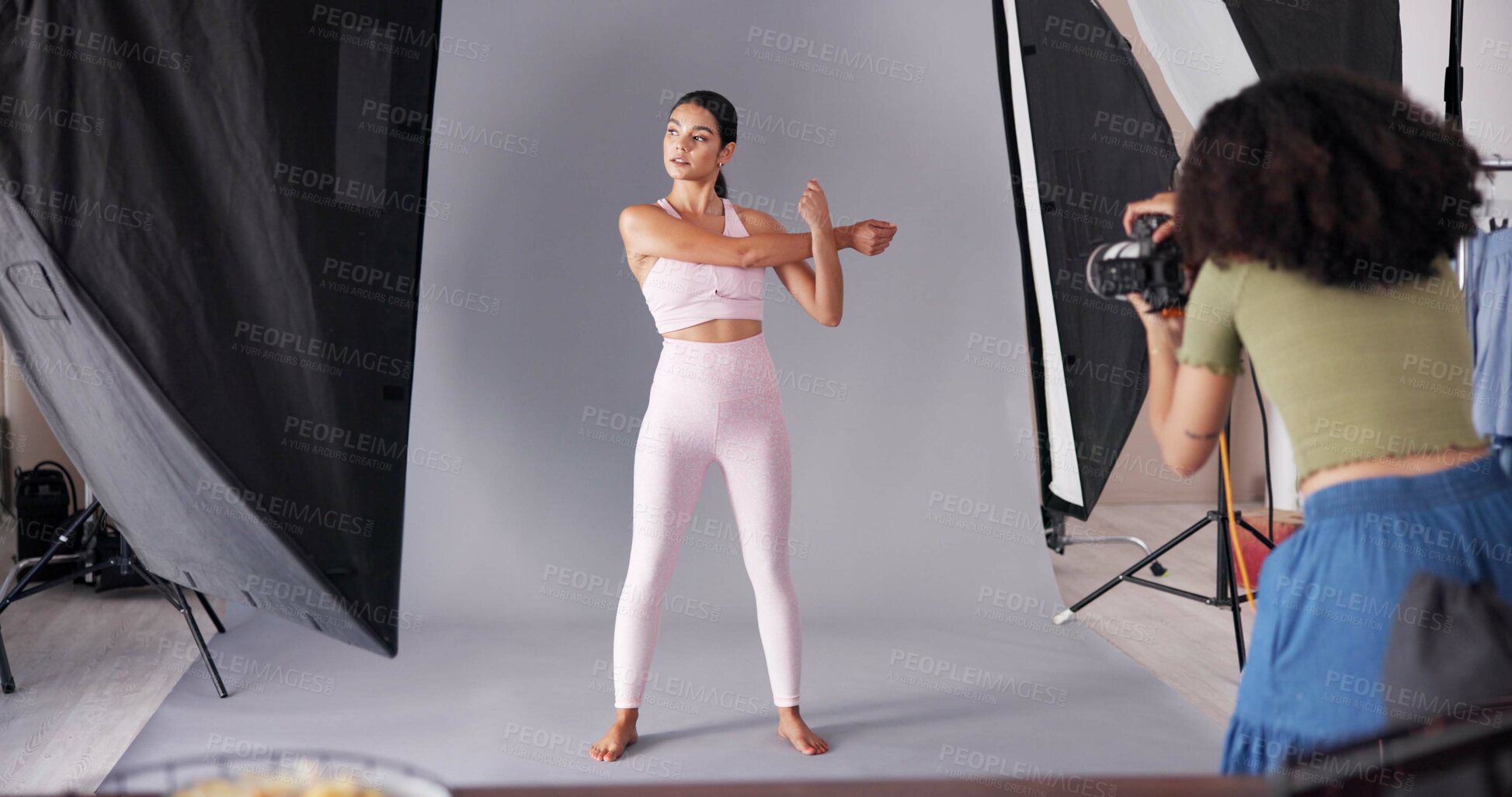 Buy stock photo Photography, sportswear and model with women in studio for branding campaign, athleisure fashion line or promotion. Behind the scenes, ecommerce photoshoot or media launch with people on set