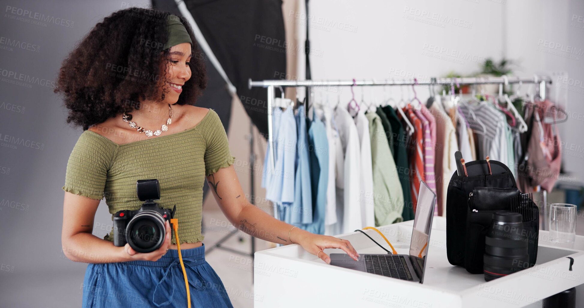 Buy stock photo Happy woman, studio and laptop with camera for production, fashion images or behind the scene. Proud photographer, smile and technology in agency for shooting catalog, content creation or videography