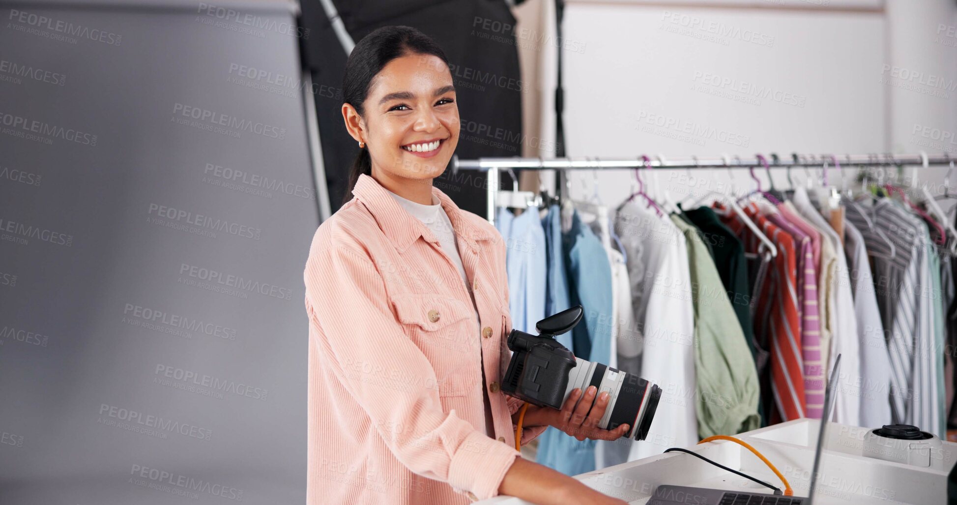 Buy stock photo Woman, laptop and portrait with camera for production, fashion advertising and behind the scene in studio. Photographer, happy and tech in agency for catalog shoot, content creation and videography