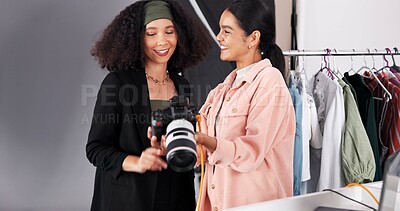 Buy stock photo People, camera and planning for photoshoot in studio, collaboration and instructions for shooting. Women, photographer and speaking to stylist for fashion feedback, review image and backstage project