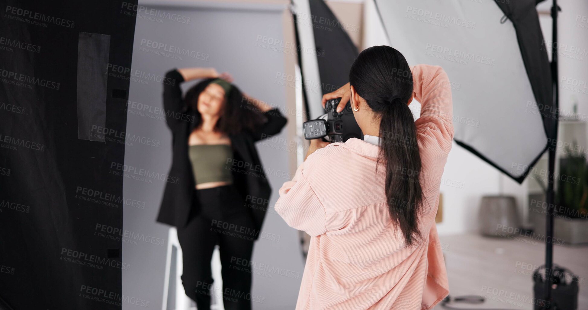 Buy stock photo Back, woman and studio photographer with model for magazine photoshoot, media or picture. Camera pose, professional photography and fashion production on set, creative process or designer advertising
