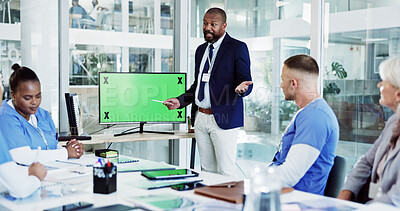 Buy stock photo Doctor, coach and presentation with green screen for healthcare training, meeting or discussion at office. Mentor, leader or speaker with medical team or tracking markers for conference at clinic