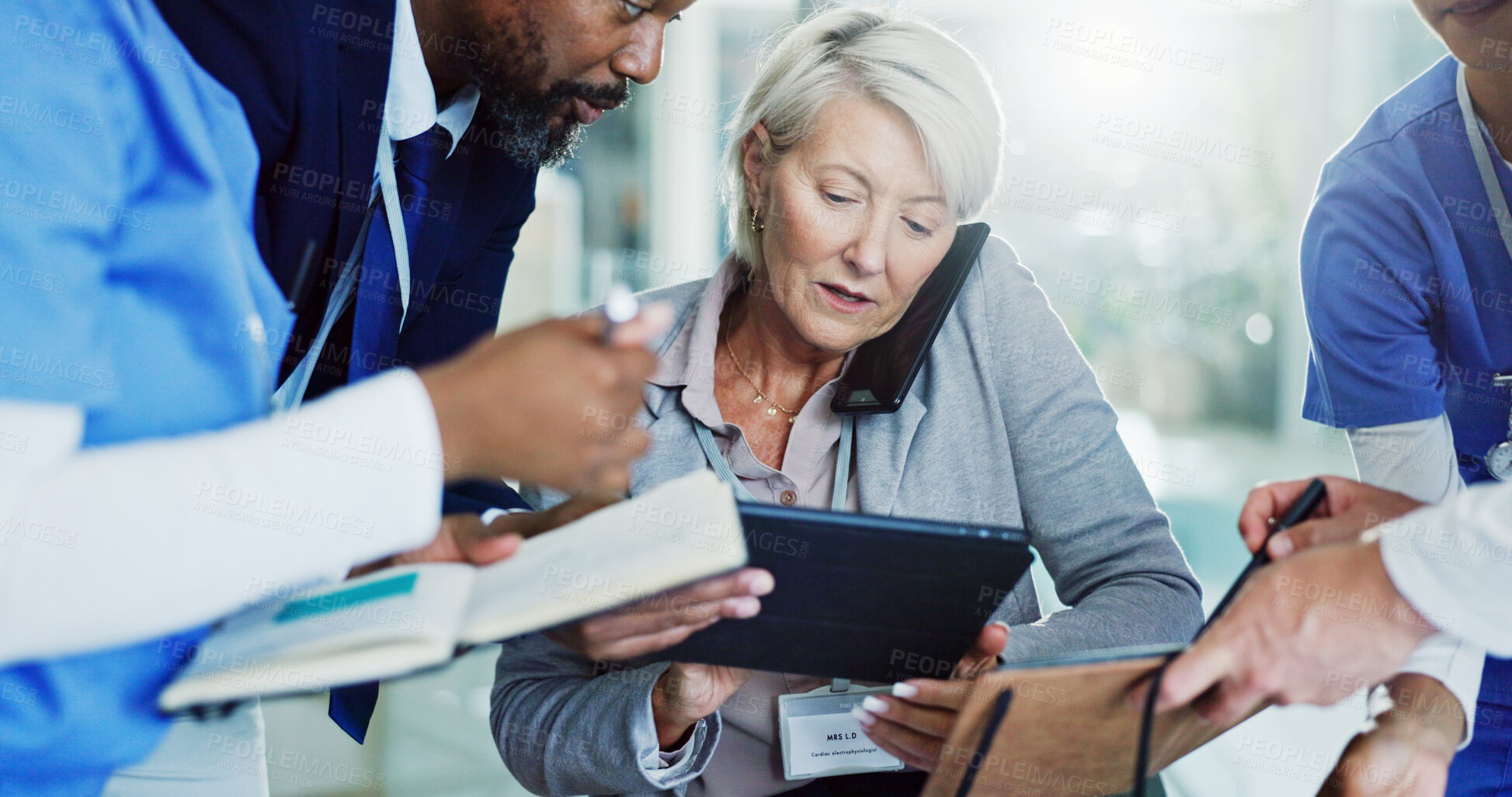 Buy stock photo Mature woman, director and multitasking with medical team for overworked pressure or chaos at busy hospital. Female person, healthcare employee or colleagues with tablet, workload or stress at clinic