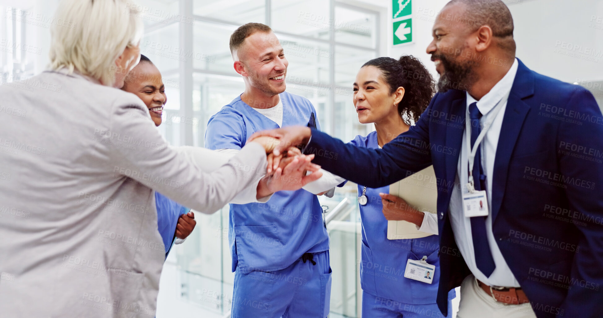 Buy stock photo Collaboration, healthcare and huddle with hospital manager speaking to staff for medical planning. Administration, management and stack of hands with medicine professional meeting team in clinic
