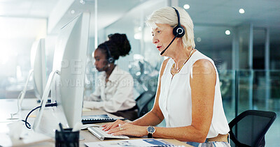 Buy stock photo Mature, woman and talk on computer at call centre of customer service, online feedback and advice. Female advisor, headset and information for technical support, telemarketing procedure and ecommerce