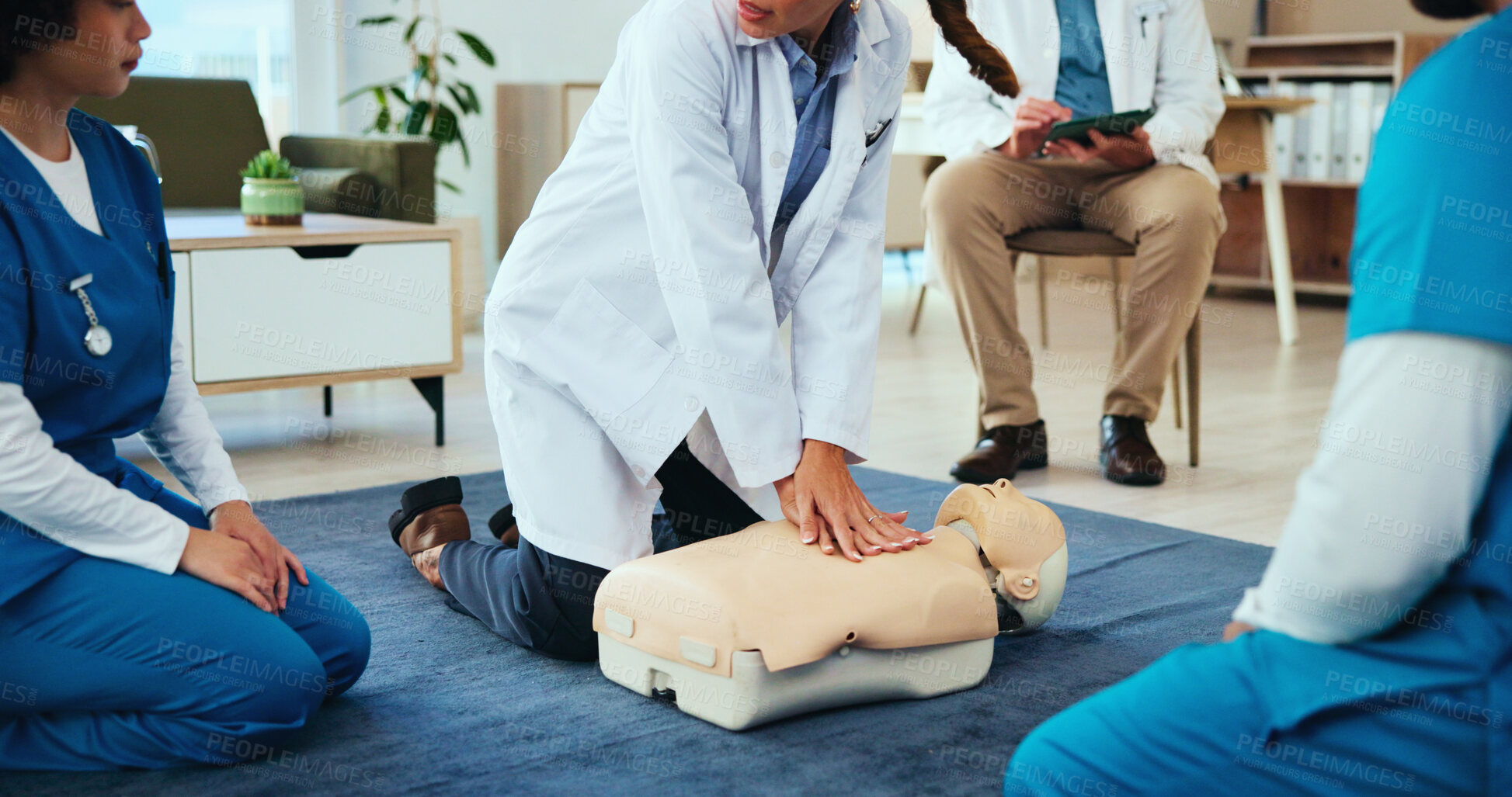 Buy stock photo Hands, cpr or doctor teaching with mannequin for first aid practice, cardiac arrest or safety protocol. Healthcare class, nurses or students in medical simulation, paramedic course or nursing school