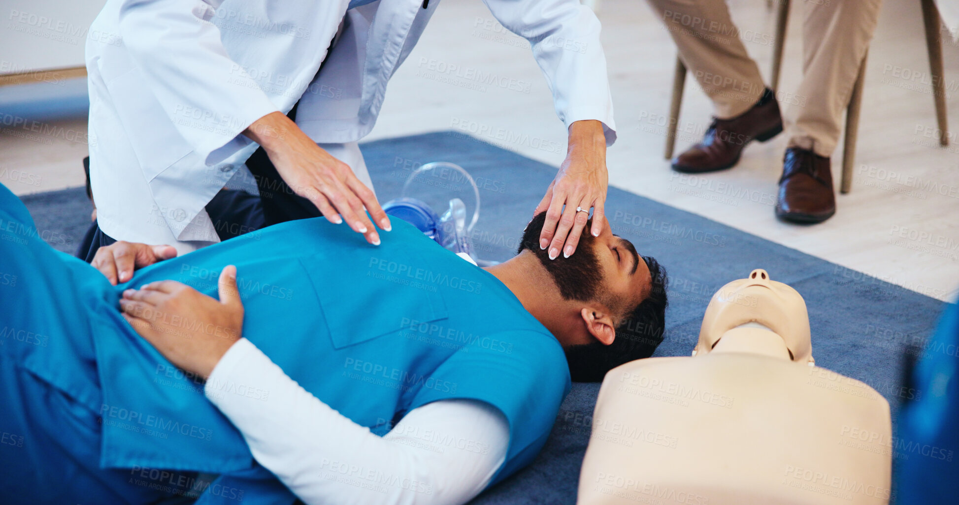 Buy stock photo Mask, hands or doctor learning cpr on person for first aid help, cardiac arrest or healthcare protocol. Medical class, students or people with respiratory tool in paramedic course or nursing school