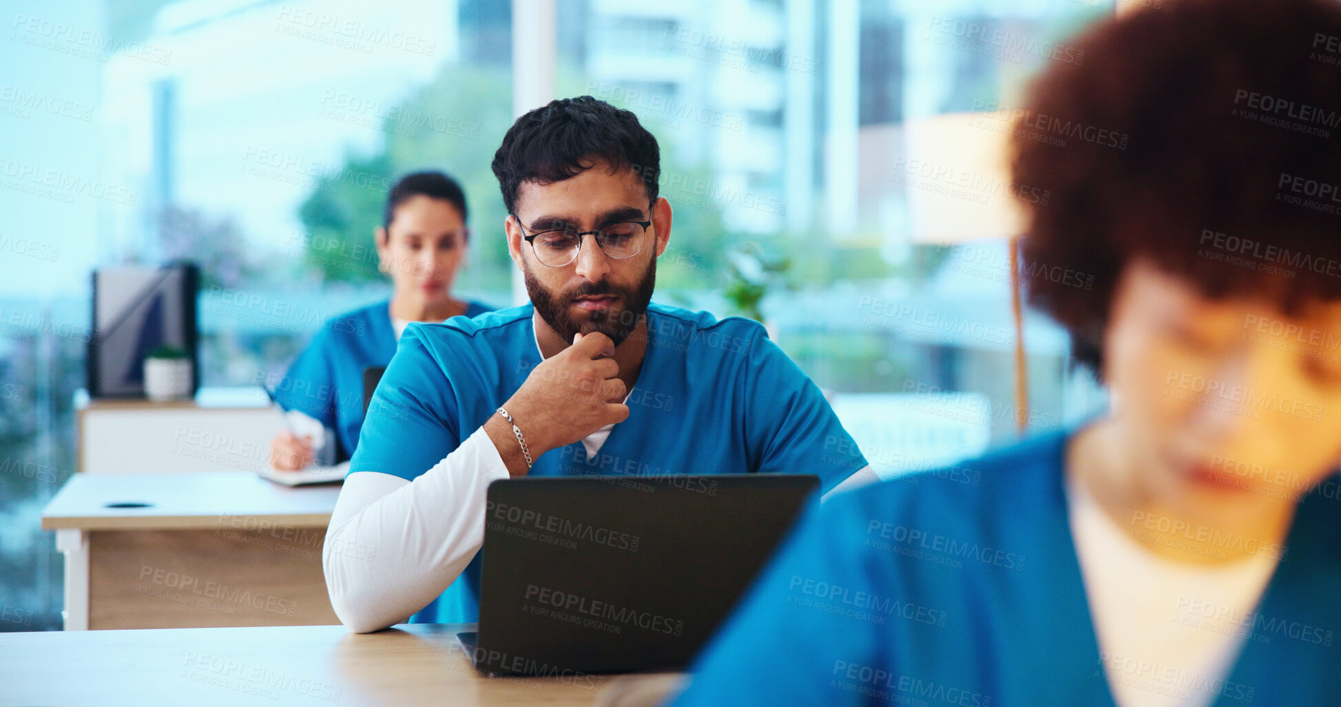 Buy stock photo Healthcare, laptop and man with test, medical school and studying for knowledge, students or classroom. Education, learning and people with info of disease, thinking or skills for license in hospital