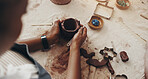 Pottery, mold and hands of person in studio for sculpture, manufacturing and artist workshop. Ceramics class, clay and creative design with closeup of artisan in handicraft store for mud and hobby