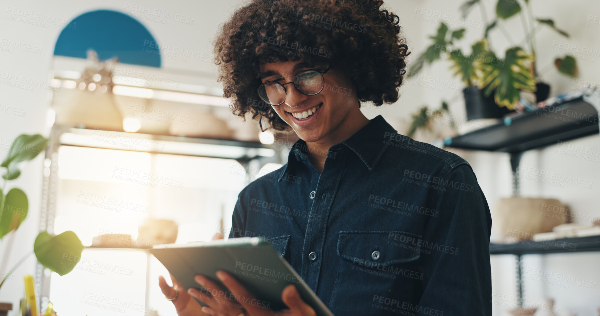 Buy stock photo Small business, smile and man with tablet, pottery and happy for positive feedback, online and creative. Browsing, entrepreneur and reading of review for shop, artisan and proud for growth of store