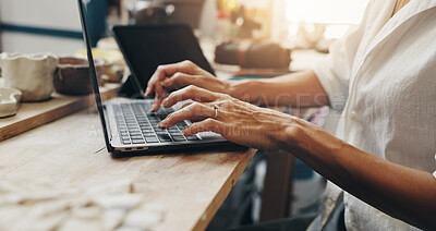 Buy stock photo Workshop, hands and person with laptop for pottery, design inspiration and verification for order. Small business, ceramist and research by closeup for clay info, track inventory and typing by flare