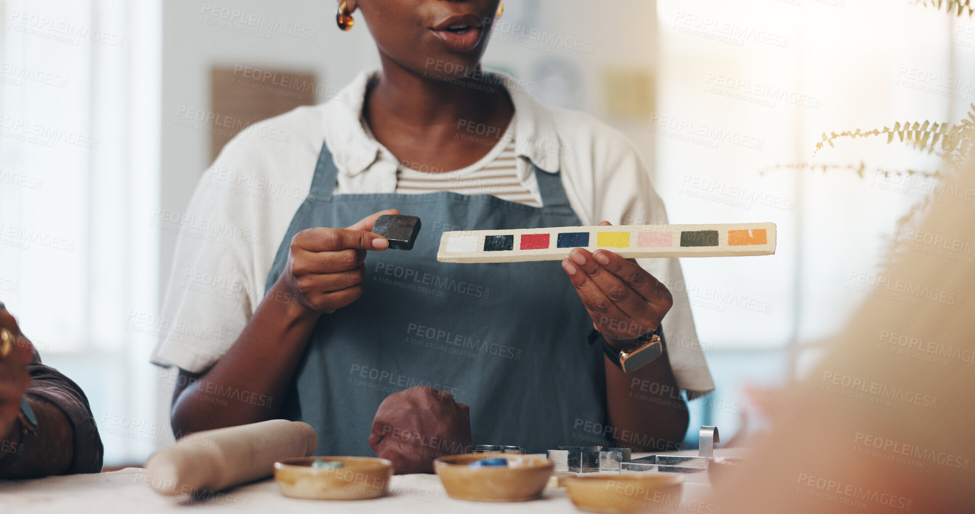 Buy stock photo Class, people and teacher with painting for pottery, development and creativity with learning in workshop. New skill, students and hands of mentor with sculpture, art design and teaching with palette
