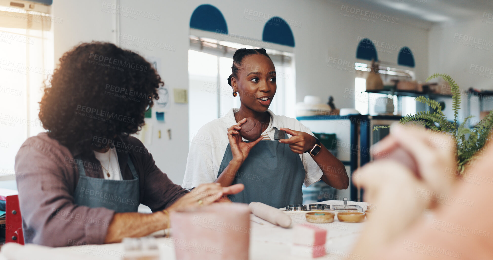Buy stock photo Workshop, people and teacher with clay for pottery, development and creativity with learning in class. New skill, students and woman as mentor with sculpture, art design and teaching with ceramic