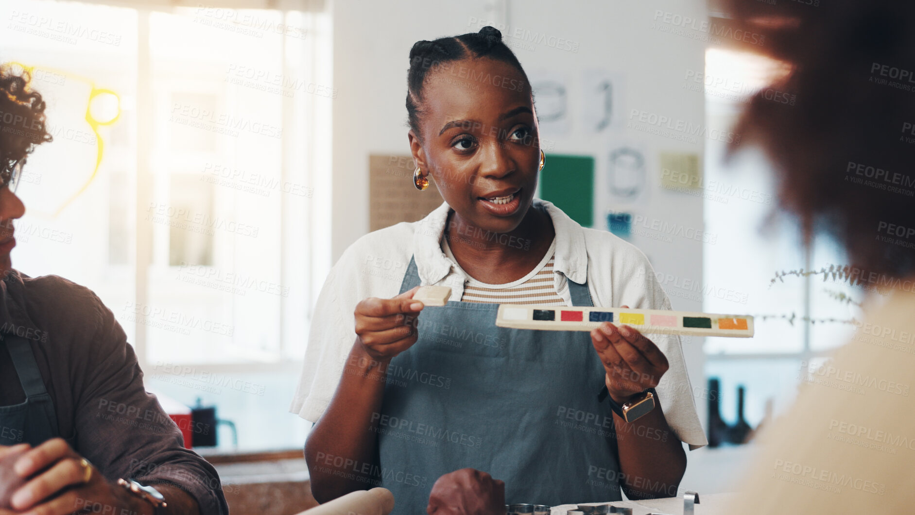 Buy stock photo Woman, pottery and class with sample, color palette and teaching for craft, art and sculpture tutorial. Person, coach and learning with clay, design and group with paint at lesson with creativity