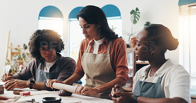Buy stock photo Workshop, students and mentor with clay for pottery, development and creative with learning in class. Group, people and woman as teacher with sculpture, mold art and teaching skills with rolling pin