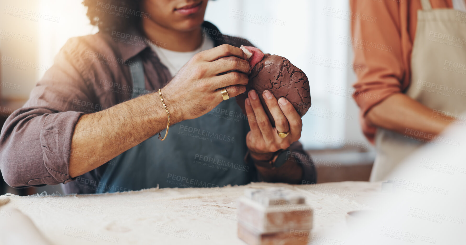 Buy stock photo Hands, class and tools for smooth pottery, clay and process for creativity with lesson at workshop. Person, learning and development at art studio, talent and inspiration for sculpture with course