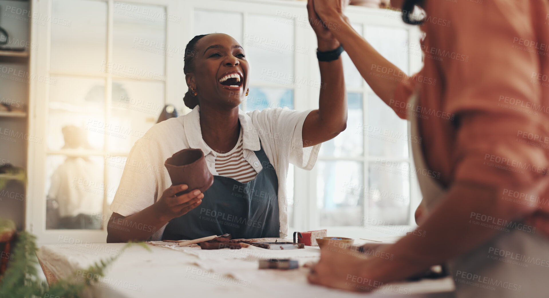 Buy stock photo Women, high five and celebration with clay for pottery, goals and success with results at workshop. People, cheers and smile with support, motivation and yes for progress with sculpture in class