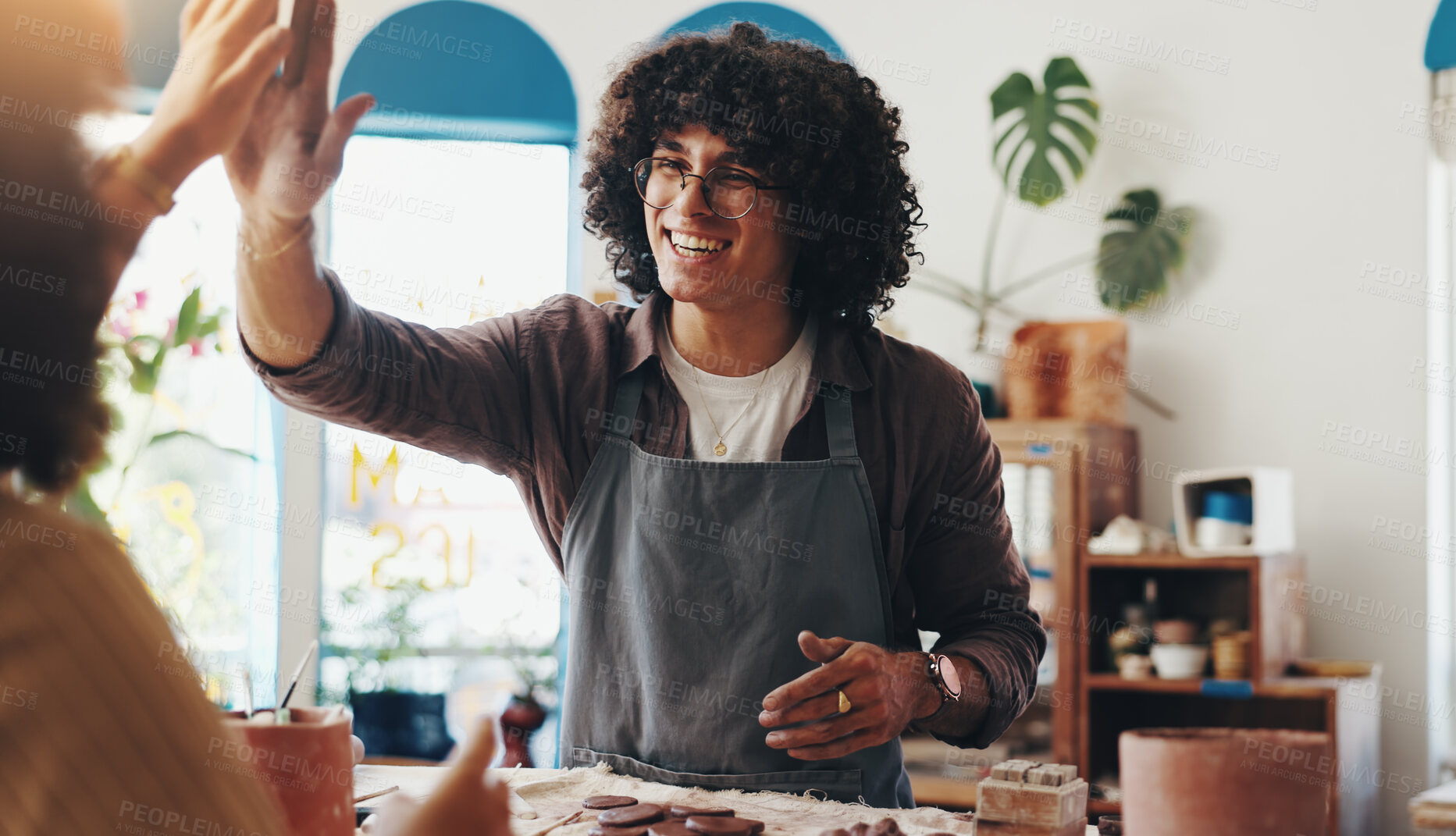 Buy stock photo Pottery, happy and man high five in workshop for design, artistic skills and learning in class. Creative, art studio and people with success excited for fun hobby, clay craft and ceramic sculpture