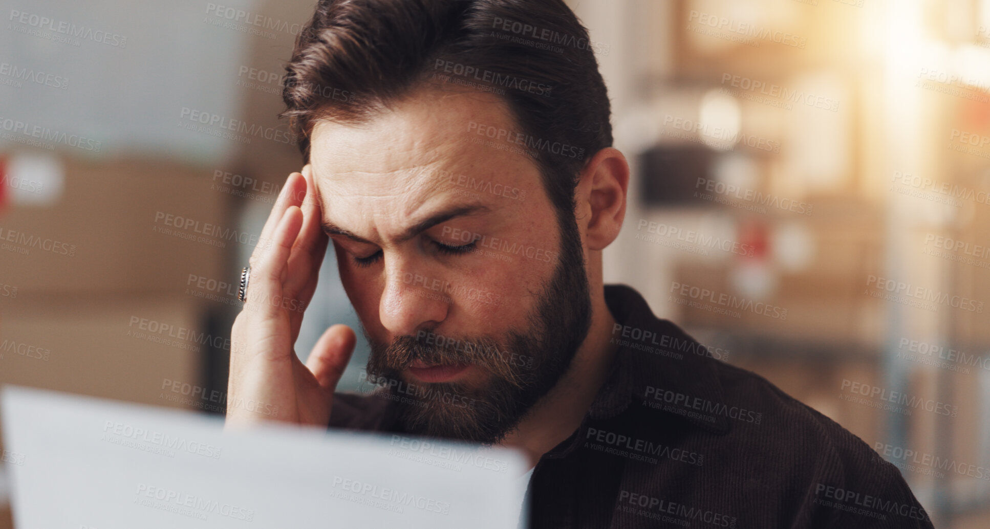 Buy stock photo Frustrated man, headache and stress with documents for tax inflation, shipping costs or freight delay at warehouse. Businessman, distributor or employee with migraine or paperwork for supplier issue
