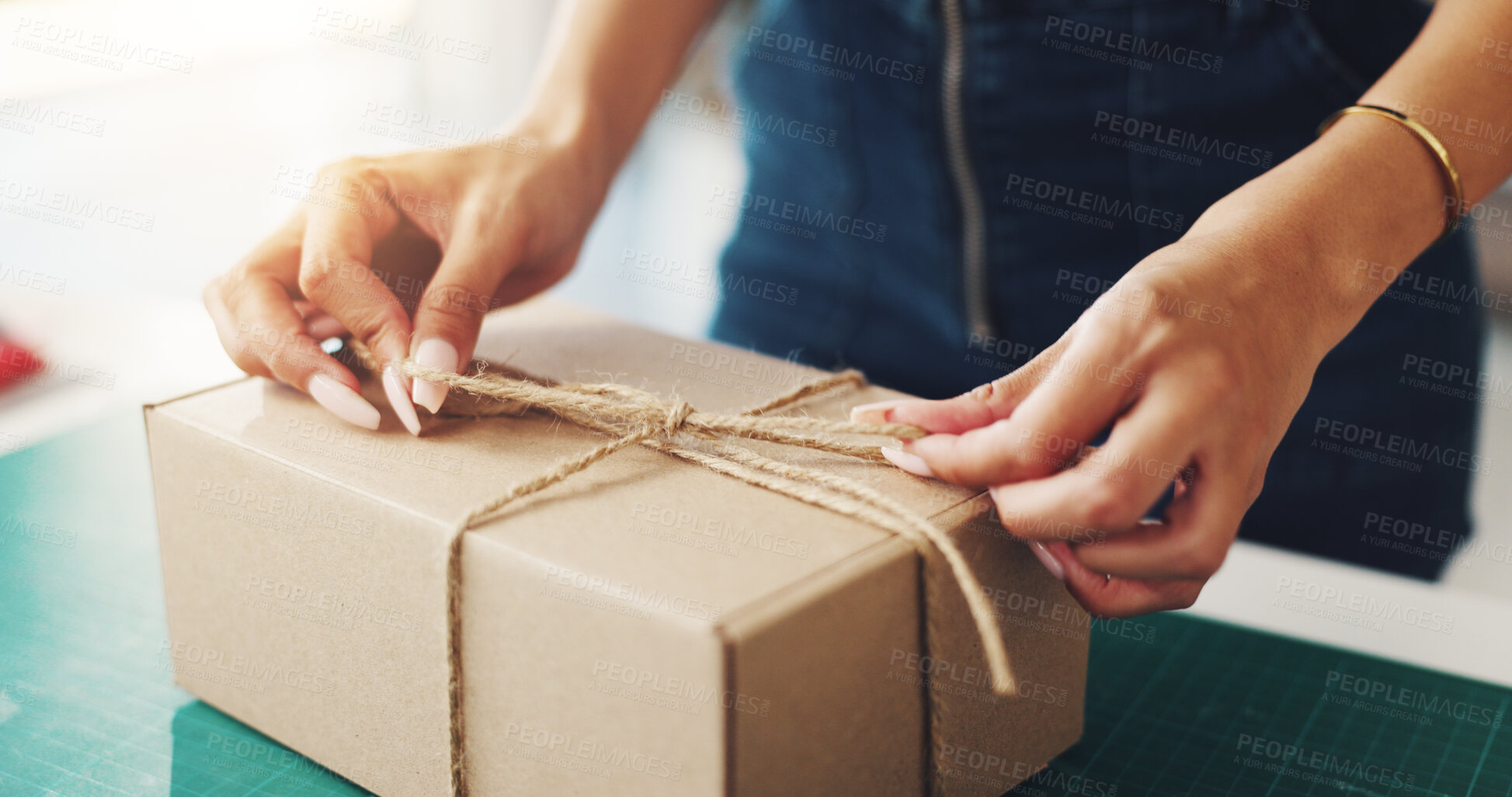Buy stock photo Person, hands and box with string for logistics, packaging or delivery in distribution industry. Closeup, distributor or parcel with knot for shipping, supply chain or export and import business
