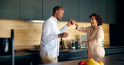 Buy stock photo Couple, laughing and dancing in home, love and playful romance in happy marriage. People, together and holding hands for commitment joy in relationship, funny humor and silly fun for connection