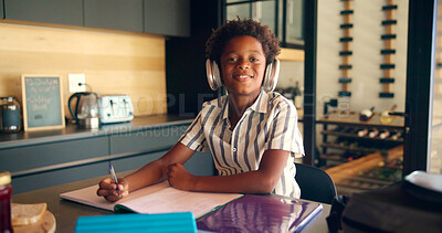 Buy stock photo Child, portrait and headphones for education in home, homework and student listening to audio. African boy, writing notes and elearning podcast for studying, language project and mind development