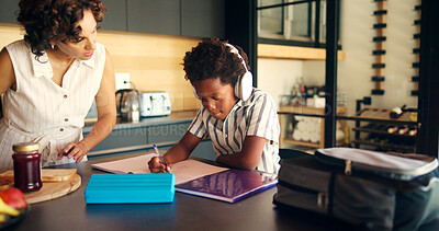 Buy stock photo Mother, homework and child learning with headphones in kitchen for education podcast and math assessment. African family, student and books with lesson support, knowledge development and study music