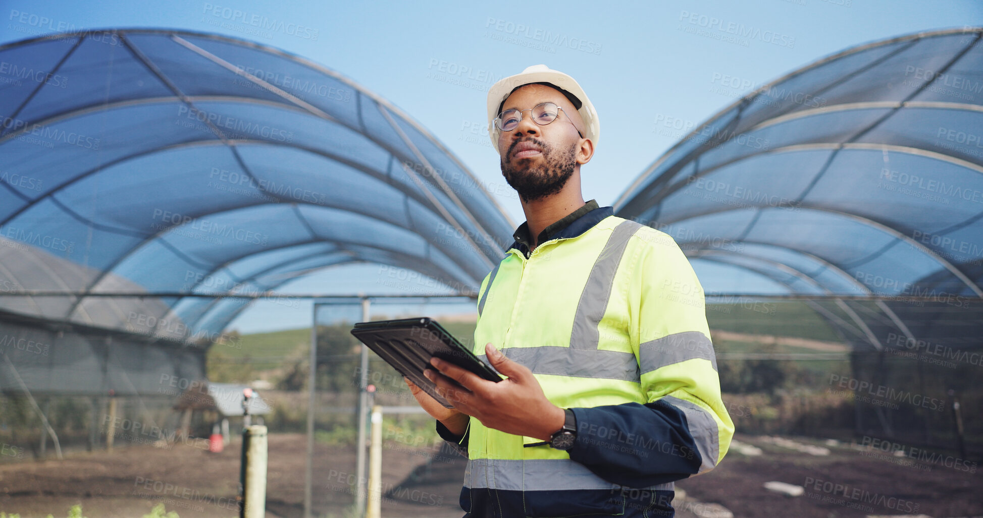 Buy stock photo Construction, engineer and man with tablet for agriculture, project development and research. Greenhouse, black person and architect with thinking for maintenance, inspection and structural stability