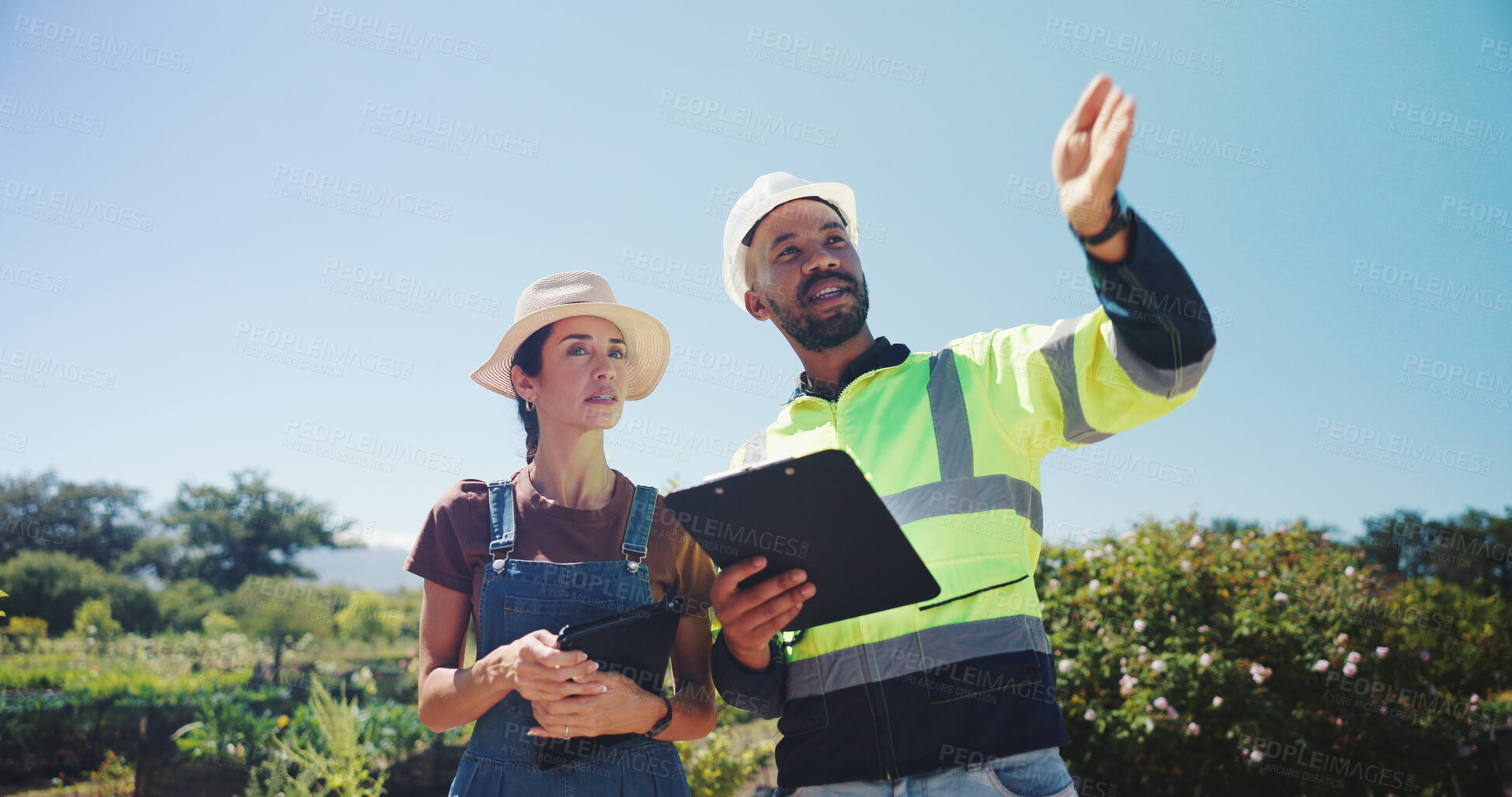 Buy stock photo People, agricultural engineer or farmer on farm for irrigation system project, sustainable environment or planning. Water management, clipboard or pointing for inspection or biodiversity conservation