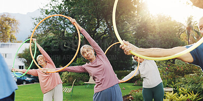 Buy stock photo Fitness, senior people and exercise with hoop for physical workout, wellness and rehabilitation. Retirement, coach and group of elderly friends for training, wellbeing and stretching with toys object
