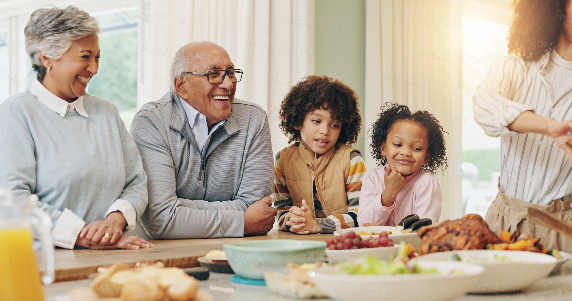 Buy stock photo Family, food and happy with dinner in home for social gathering, celebration and weekend bonding. People, parents and grandparents with kids for holiday tradition, roast feast and connection in house