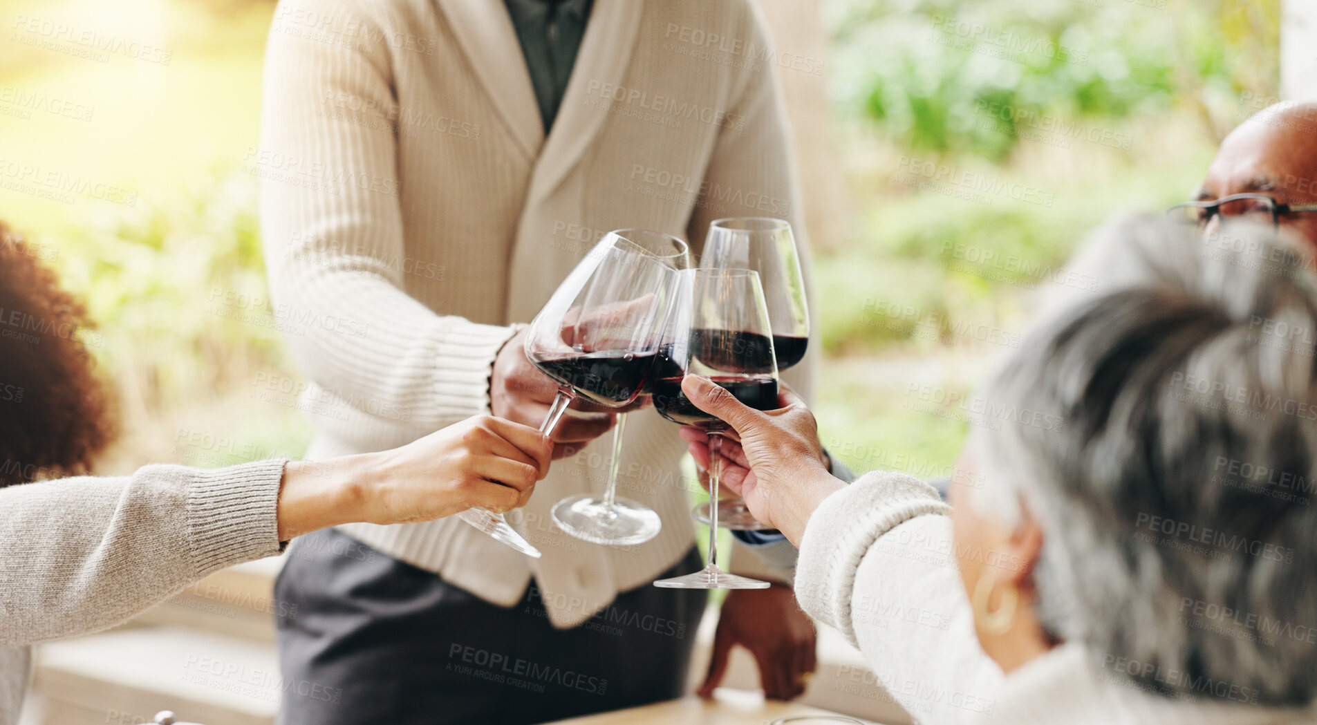 Buy stock photo Family, toast and outdoor hands for celebration on vacation, easter lunch and proud to connect. People, cheers and sharing traditional holiday in home backyard, social gathering and patio party