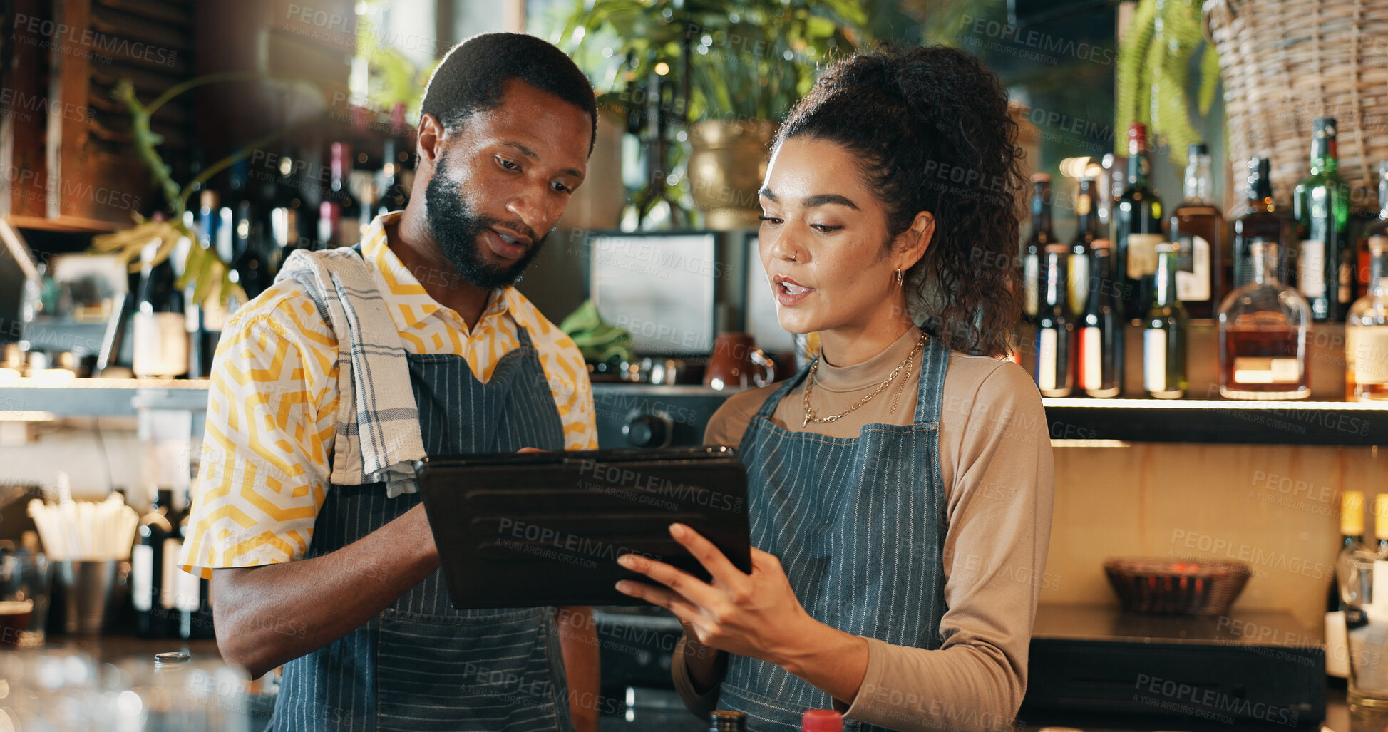 Buy stock photo Restaurant, teamwork and people on tablet for training for inventory, menu items and checklist by bar. Alcohol, business and man with woman on digital tech for hospitality, service and online order