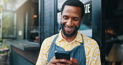 Buy stock photo Black man, waiter and phone for typing outdoor at cafe, social media break and communication in coffee shop. Text, hospitality service and male person online by restaurant, reading message and chat