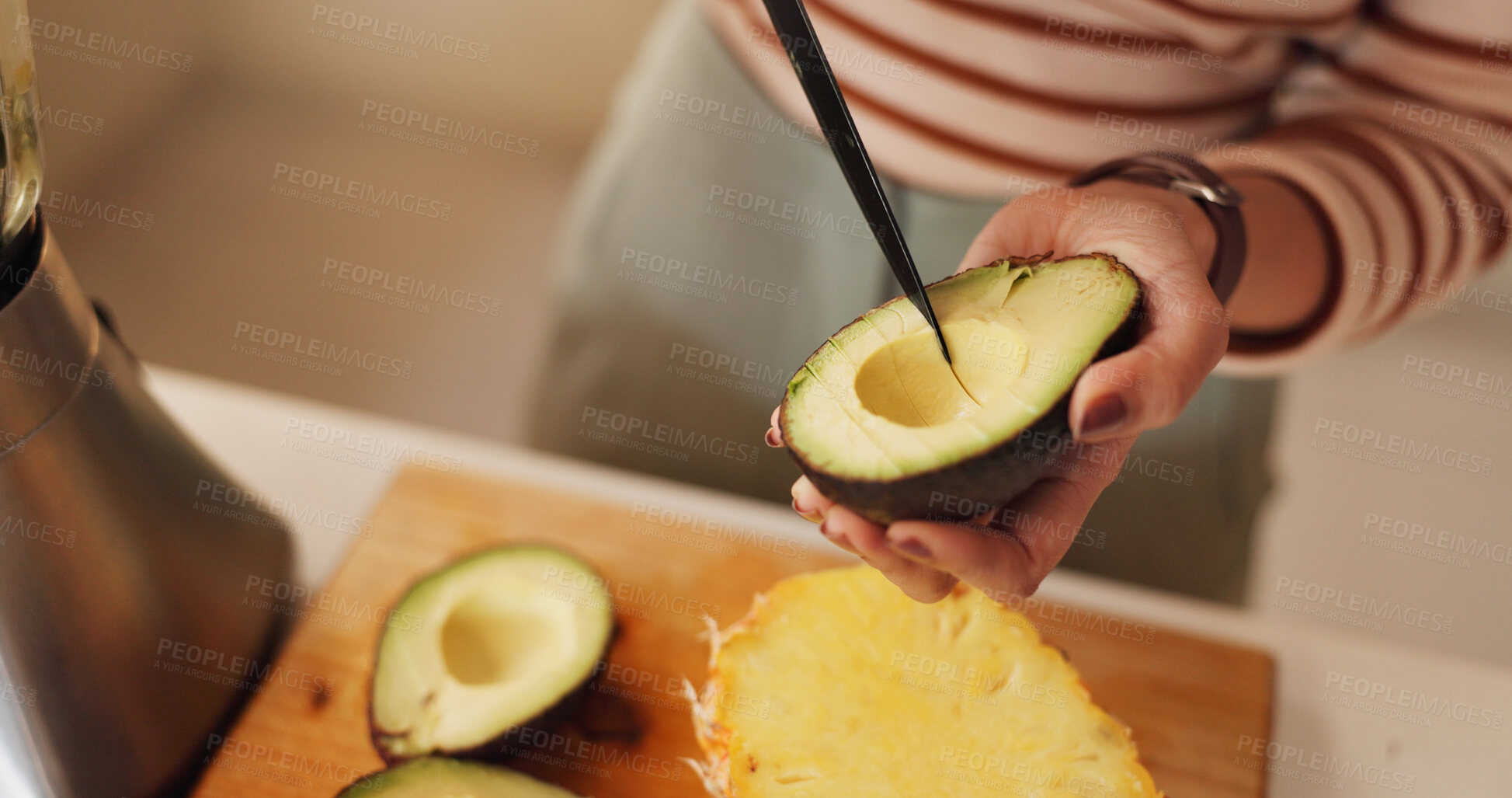 Buy stock photo Woman, hands and avocado for smoothie in home, prepare organic shake and cutting ingredients. Person, breakfast fruit and minerals for gut health nutrition in kitchen, vegan diet and morning fiber