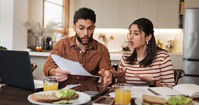 Buy stock photo Couple, paperwork and stress for finance in home with financial planning, account mistake or asset management. People, laptop and fighting for bankruptcy, insurance bills and mortgage at breakfast