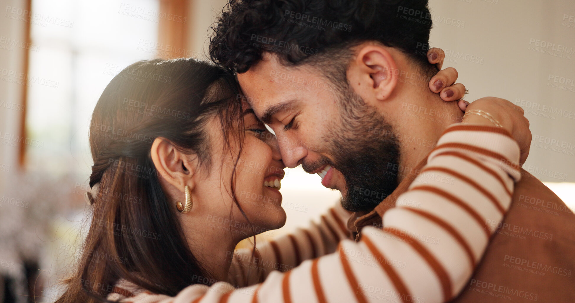 Buy stock photo Couple, happy and laughing in home embrace, communication and trust in relationship. Partner, romance and support husband with commitment in love, bonding and sweet moment of affection in marriage