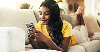 Buy stock photo Resting, reading and woman with smartphone, home and smile for romance ebook, online and comfortable. Lounge, relax and entertainment for person with mobile, website and browsing of novel in house