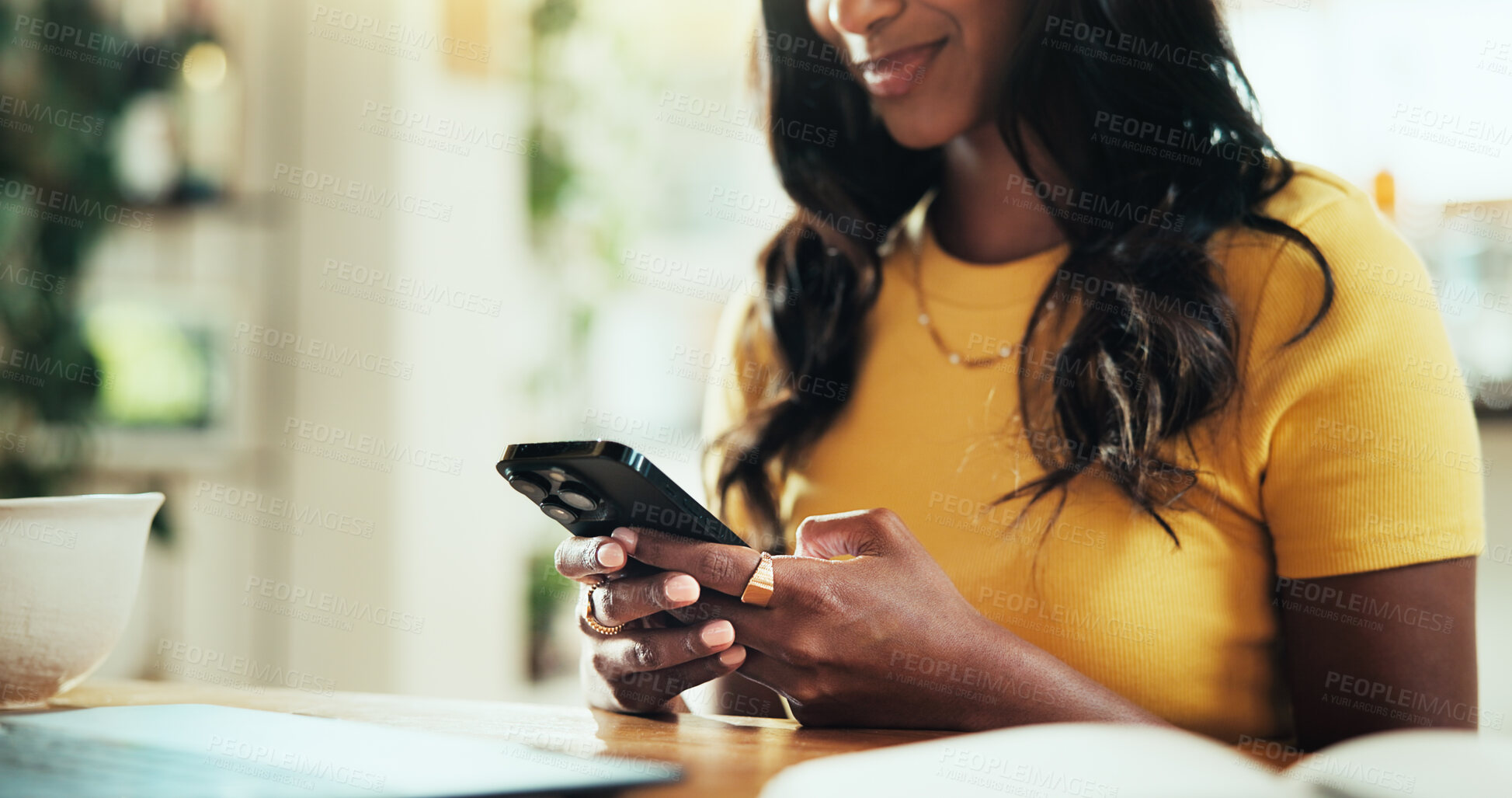 Buy stock photo Hands, phone and chat with woman in house for social media post, streaming and network platform. Reading, notification and mobile app with closeup of person at table of home for story update