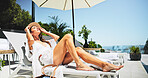 Woman, sunbathing and deck chair with vacation, rest and relax for trip, break and travel. Luxury resort, peace and girl with smile, adventure and carefree for hotel accommodation or hospitality